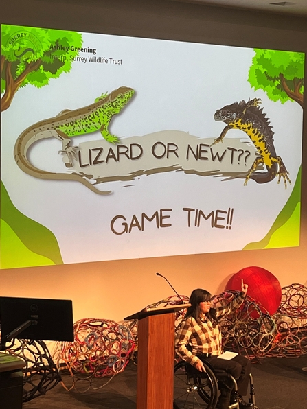 Ashley on stage presenting her quiz 'Lizard or Newt' at Surrey Hills Symposium