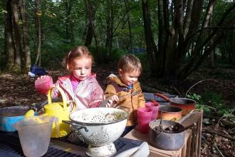 Wild Tots play in a mud kitchen