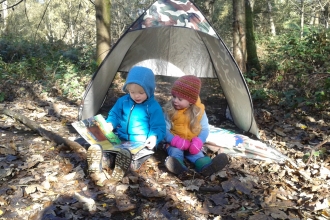 Wild Tots reading in tent