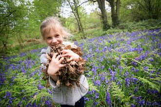 Girl in bluebell wood