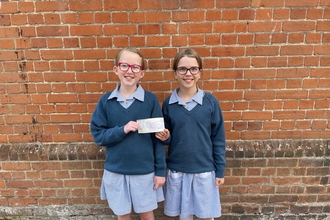 Surrey school children presenting cheque donation