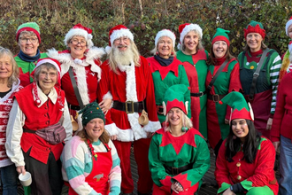 Nower Wood volunteers and staff dressed in bright, festive outfits