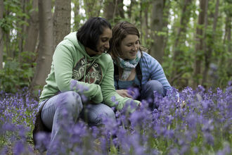 Bluebells - two young women looking at flowers