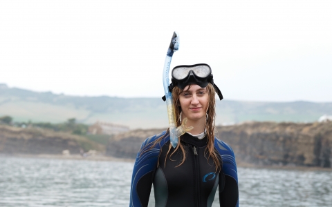 Heather in a wetsuit in the sea