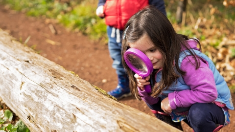 Girl with magnifying glass