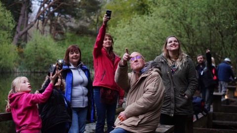 A group of people using bat detectors