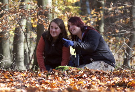 Woman and girl in autumn woods