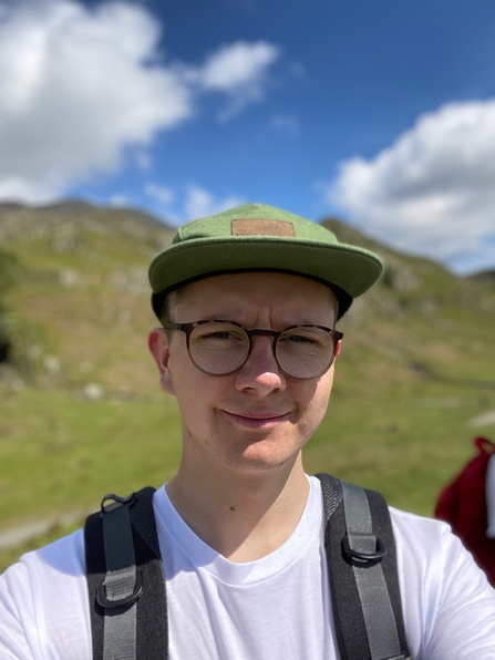 Young man taking a selfie in the countryside