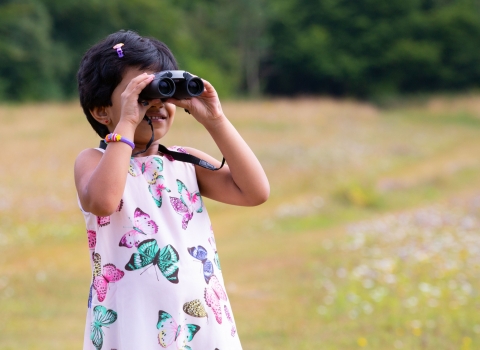 Child with binoculars